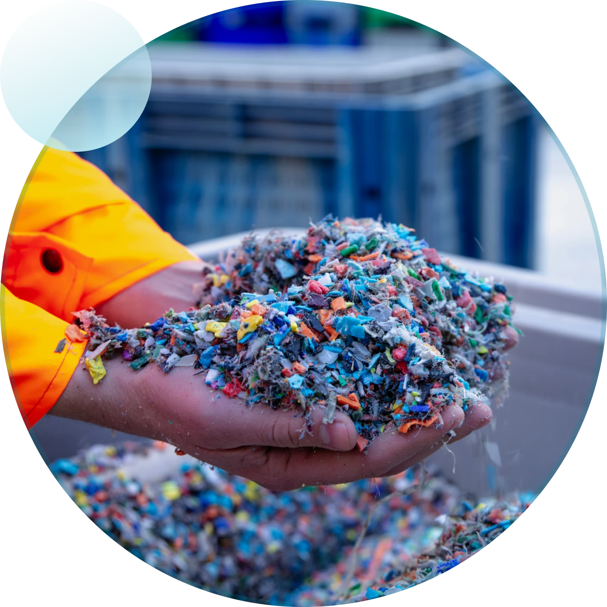 Recycled plastic pieces in hands